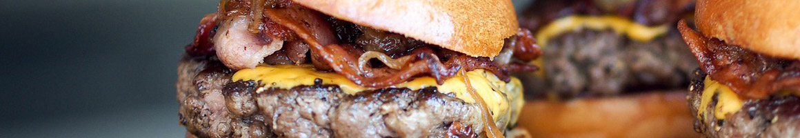 Eating Burger Hot Dog Pub Food at Black Sheep Lodge restaurant in Austin, TX.